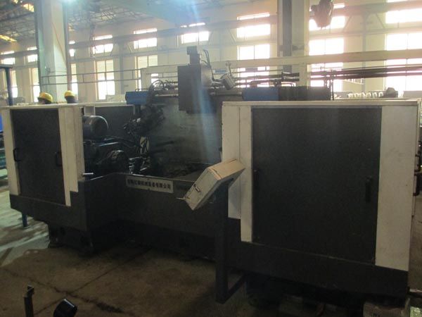 扭力樑(liang)雙麵銑削(xue)組郃機牀